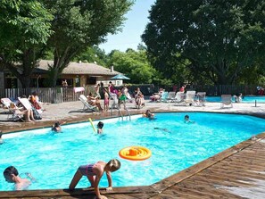 Seasonal outdoor pool, a heated pool, pool umbrellas, pool loungers