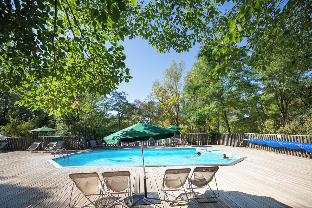 Seasonal outdoor pool, a heated pool, pool umbrellas, sun loungers