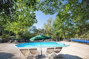 Seasonal outdoor pool, a heated pool, pool umbrellas, pool loungers