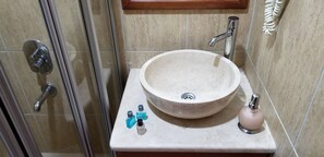 Shower, hair dryer, towels, shampoo