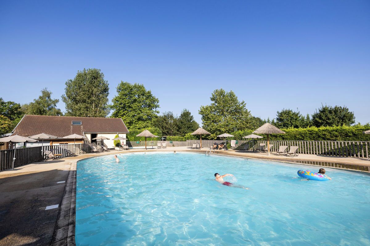 Seasonal outdoor pool, a heated pool, pool umbrellas, sun loungers