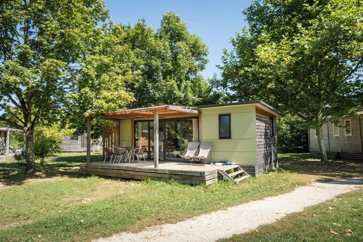 A small, single-story building with a covered patio area.