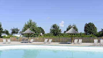 Seasonal outdoor pool, a heated pool, pool umbrellas, pool loungers
