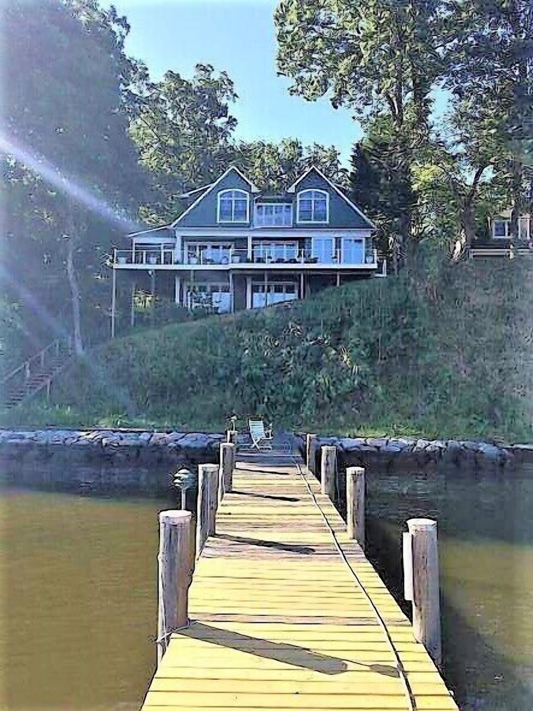 A huge deck and screen porch on this contemporary cape in Edgewater offers great views of Beard's Creek and out onto the South River.