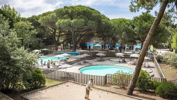 Seasonal outdoor pool, open 9:00 AM to 7:00 PM, pool umbrellas