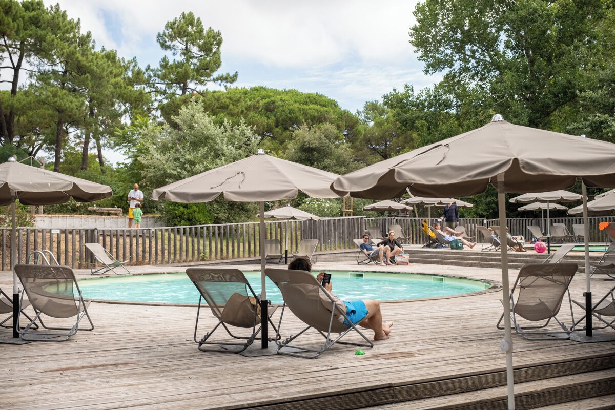 Seasonal outdoor pool, open 9:00 AM to 7:00 PM, pool umbrellas