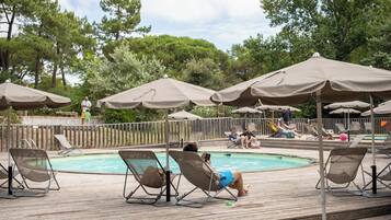 Seasonal outdoor pool, open 9:00 AM to 7:00 PM, pool umbrellas