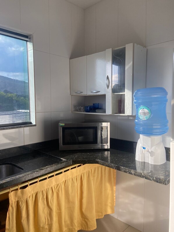 Fridge, stovetop, coffee/tea maker, cookware/dishes/utensils