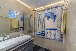 Shower, towels, soap, toilet paper