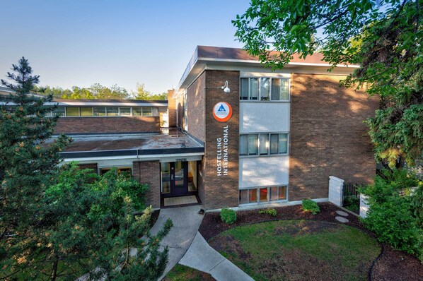A hostel building with a sign reading "Hostelling International."