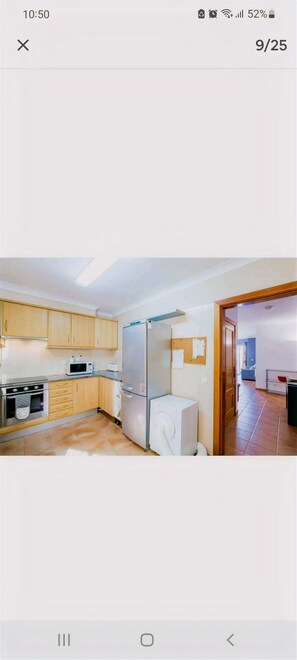 Enjoy cooking in this well-equipped kitchen with a refrigerator, microwave, and oven.