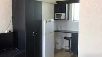 Desk, laptop workspace, blackout drapes, iron/ironing board
