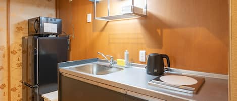 Apartment (102, KAGA) | Private kitchenette | Full-sized fridge, microwave, stovetop, electric kettle