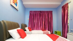 A hotel room with two beds, a large window with purple curtains, a green side table, and a painting on the wall. - OYO 1103 Borneo Inn (Kota Kinabalu)