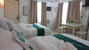 Twin Room, 2 Queen Beds | Free WiFi, bed sheets - Cronin Inn by Cocotel (Oslob)