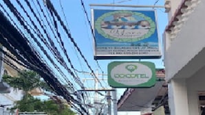 A narrow street with a sign for a hotel named "Cocotel." - El Moro Beach Resort by Cocotel (Boracay Island)