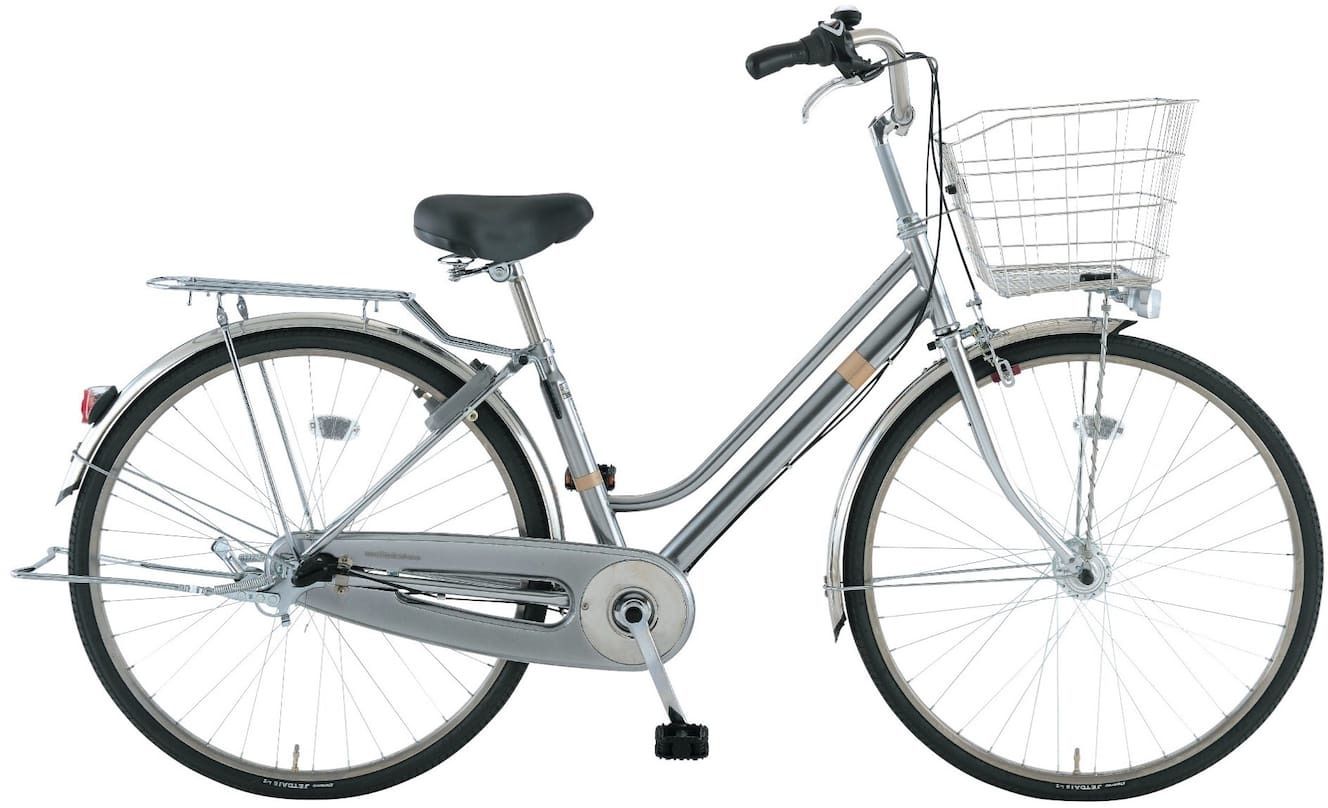 A stationary bicycle with a basket, a seat, and a rear rack.