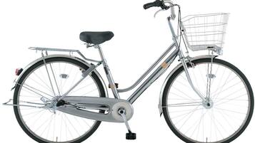 A stationary bicycle with a basket, a seat, and a rear rack.