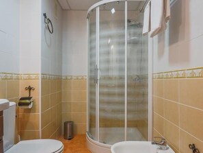 Bathtub, hair dryer, towels