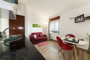 Apartment, 1 Bedroom, Sea View | Living area | Flat-screen TV