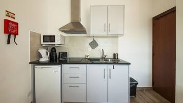 Apartment, 1 Bedroom, Sea View | Private kitchen | Full-size fridge, microwave, electric kettle, toaster