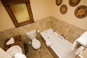 Family House, 3 Bedrooms | Bathroom | Separate bathtub and shower, rainfall showerhead, towels, soap - Cambalala Kruger Park Lodge (Mbombela)