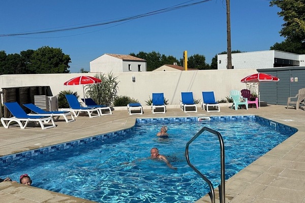 Seasonal outdoor pool, open 10:00 AM to 8:00 PM, pool umbrellas