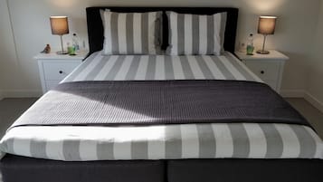 Hypo-allergenic bedding, desk, laptop workspace, blackout curtains