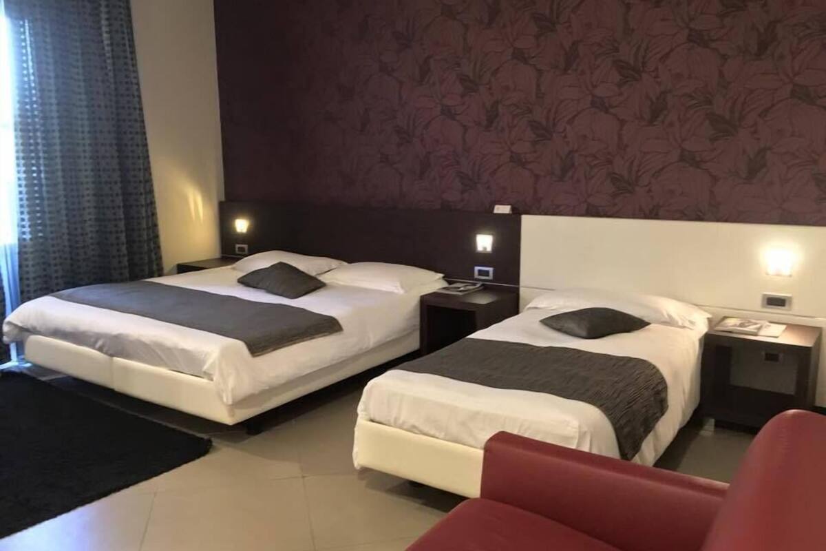 Triple Room, Private Bathroom | Minibar, desk, WiFi (free), bed sheets