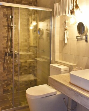 Deluxe Apartment, 1 Bedroom, City View, Ground Floor (Euphoria) | Bathroom | Shower, rainfall showerhead, hair dryer, bathrobes