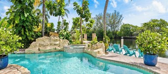 Discover Pineapple Paradise, a Stylish Modern Tropical Waterway Retreat with Poolside Relaxation!