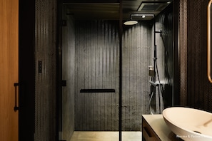 Eco-friendly toiletries, hair dryer, slippers, bidet