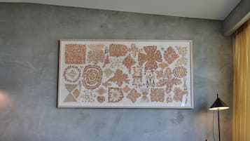 A framed botanical print on a textured gray wall.