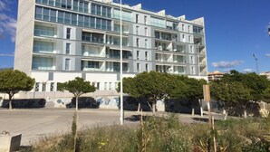 A modern multi-story building with balconies and large windows. - Fine apartment by the sea, beach, nice and quiet yet close to Center (Villajoyosa)