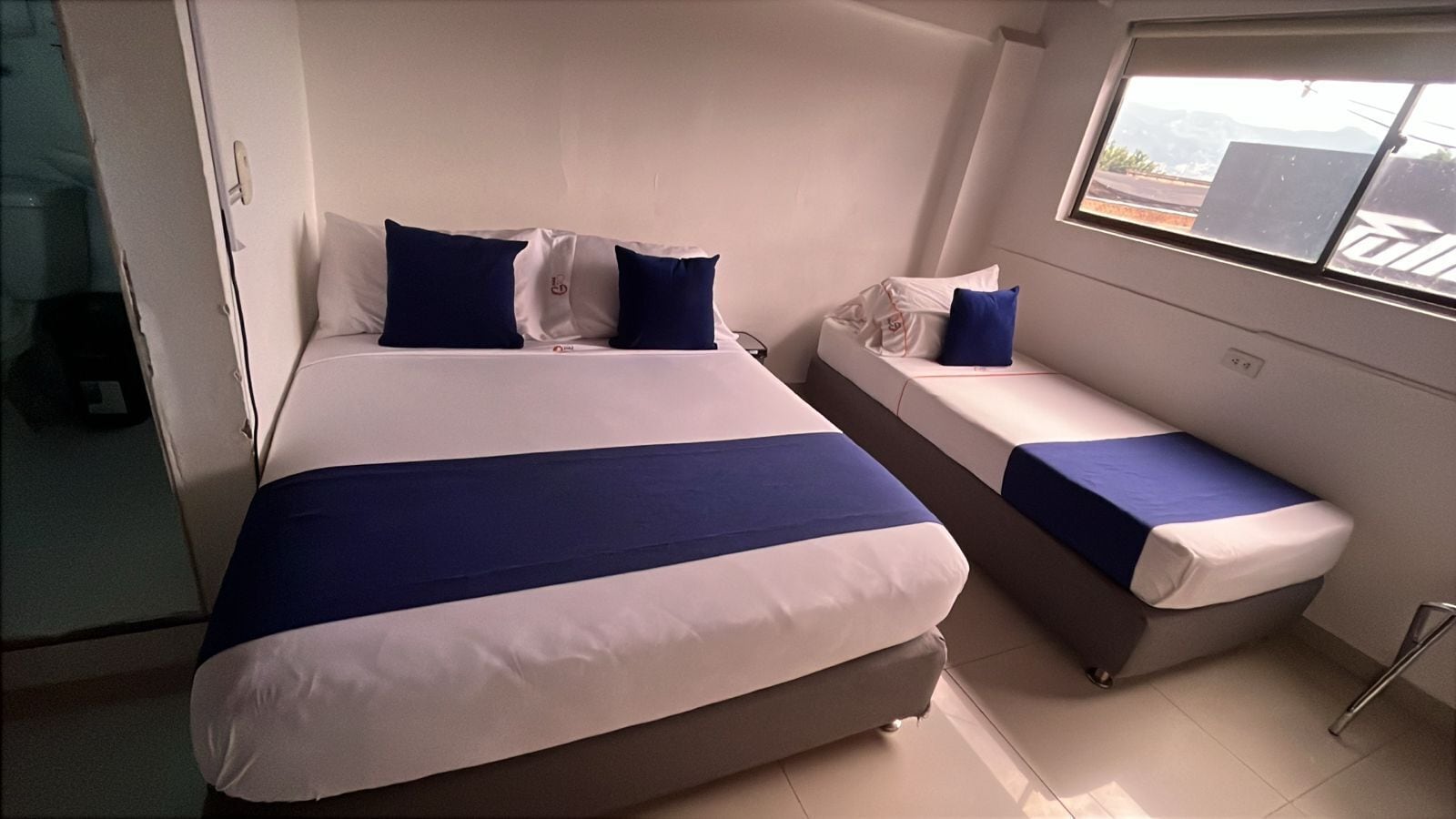 Family Triple Room | Minibar, desk, blackout curtains, iron/ironing board