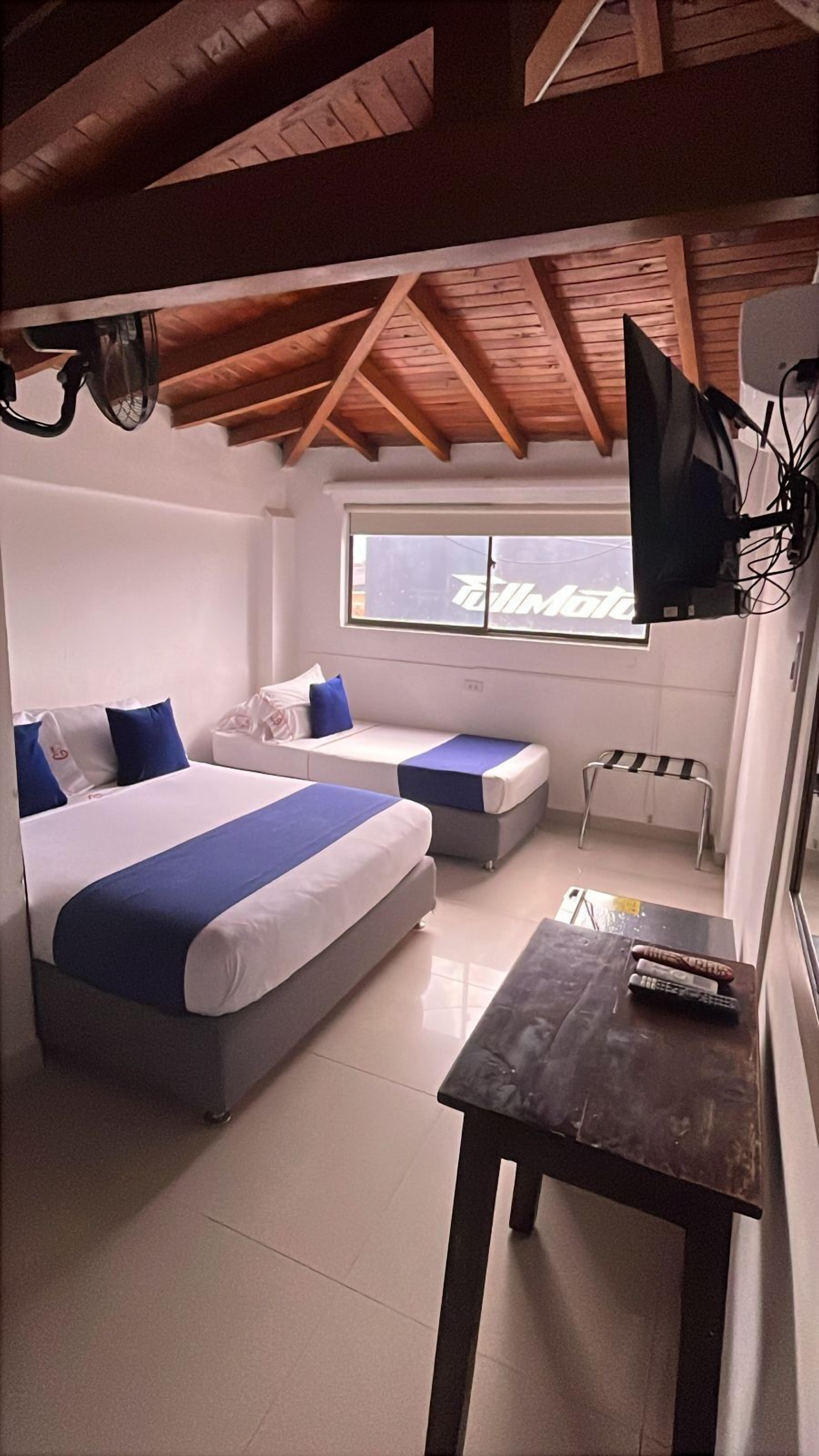 Family Room | Minibar, desk, blackout curtains, iron/ironing board