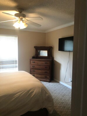 Master Bedroom - TV on wall. Dresser in corner. Large(ish) closet also in master