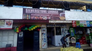 A storefront with a sign for "Silverstone Lounge" offering drinks, music, food, and accommodation. - Silverstone Park Bar & Guest House (Nairobi)