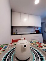 Full-size fridge, microwave, stovetop, espresso maker