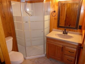Shower, towels, soap, toilet paper
