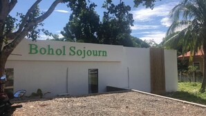 A building with a sign reading "Bohol Sojourn". - Bohol Sojourn (Panglao)