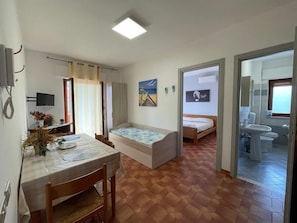 Apartment, 1 Bedroom (Aurora) | 1 bedroom, blackout drapes, iron/ironing board, free WiFi