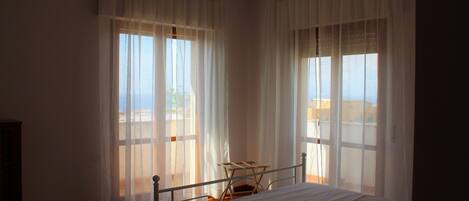 Family Apartment, 2 Bedrooms, Balcony, Partial Sea View (Orchidea vista mare) | 2 bedrooms, individually decorated, free WiFi