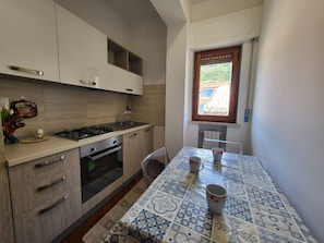 Apartment, 2 Bedrooms, Balcony, City View (Orchidea con vista sui monti) | Private kitchen | Full-sized fridge, oven, stovetop, espresso maker - Orchidea (Tropea)