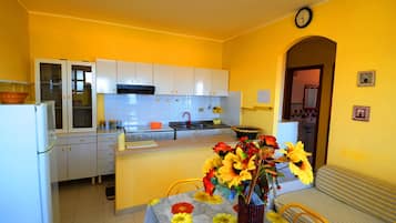 Apartment, 2 Bedrooms (Appartamento 7) | Private kitchen | Full-sized fridge, oven, stovetop, espresso maker