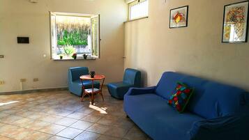 Villa, 2 Bedrooms, Garden View (Villa Cecile piano terra) | Living area | Flat-screen TV