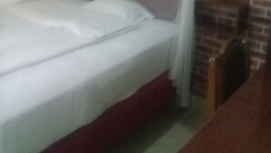 A bed with a white mattress and a canopy. - Beston Hotel Bungoma (Chwele)