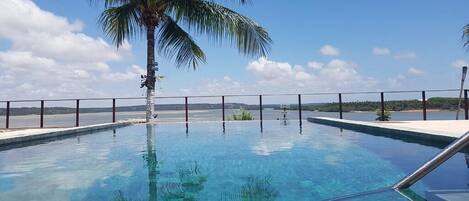 Outdoor pool, open 9:00 AM to 10:00 PM, pool umbrellas, sun loungers