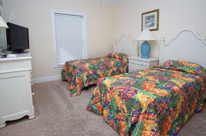 A bedroom with two beds, a TV, a lamp, and a window with blinds. - Spacious home w/saltwater pool, 1.5 blocks from beach, covered porch-in popular Cherry Grove (North Myrtle Beach)