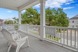 Relax on the covered porch with a comfortable seating area.